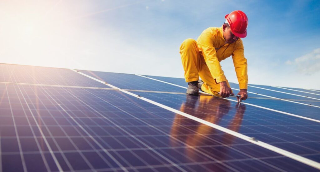 Falco Solar technician servicing a panel